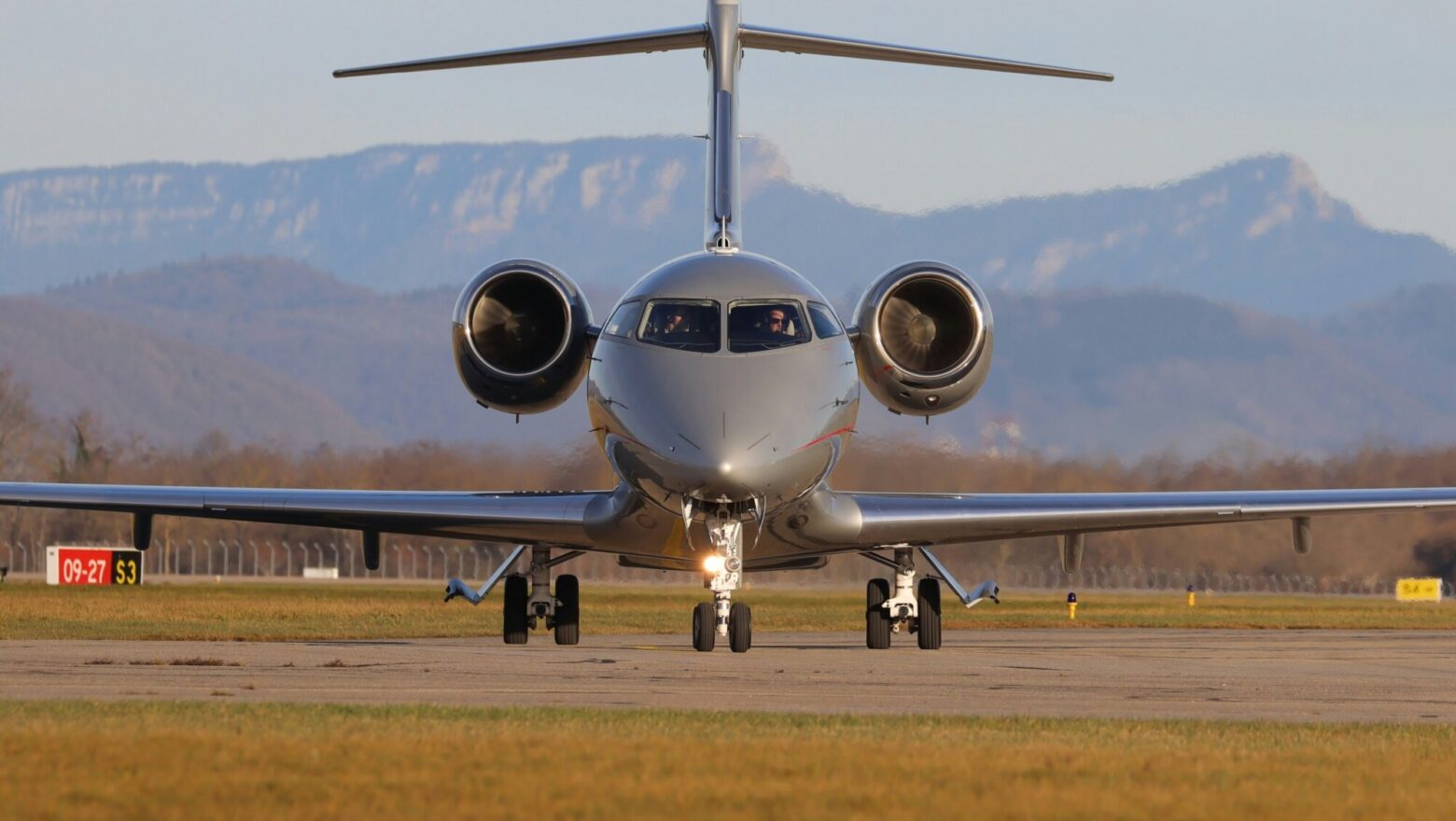 a large jetliner sitting on top of an airport runway